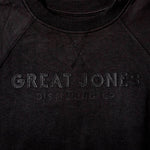 Closeup of black tonal applique Great Jones logo