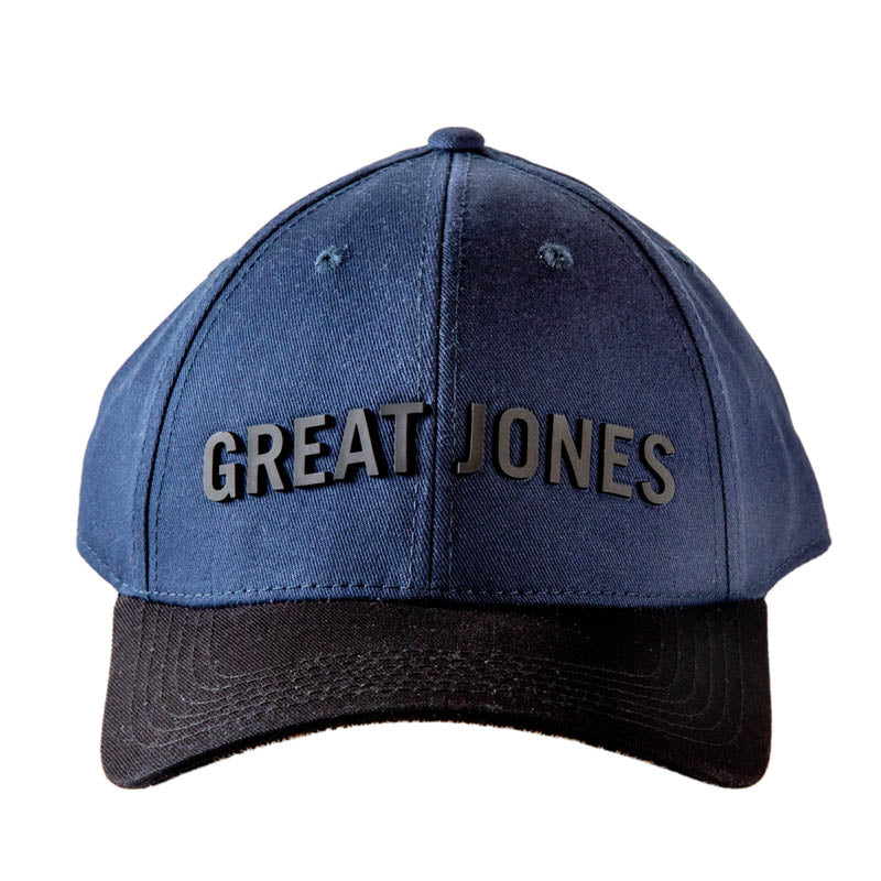 Front facing view of Blue Great Jones hat with black logo and black brim