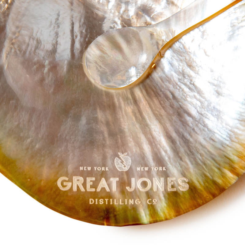Closeup of Great Jones Caviar Dish and Spoon etched logo 