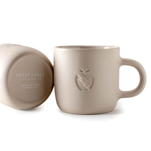 
                  
                    Great Jones x Franca cream colored ceramic mugs on white background
                  
                