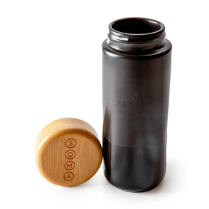 
                  
                    Great Jones Soma ceramuc mug with bamboo top on white background
                  
                