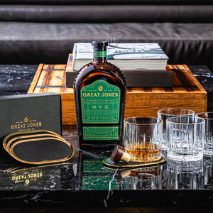 
                  
                    Great Jones Rye Whiskey with Crystal Rocks Glass (set of 4) and Brass Coasters (Set of 4)
                  
                